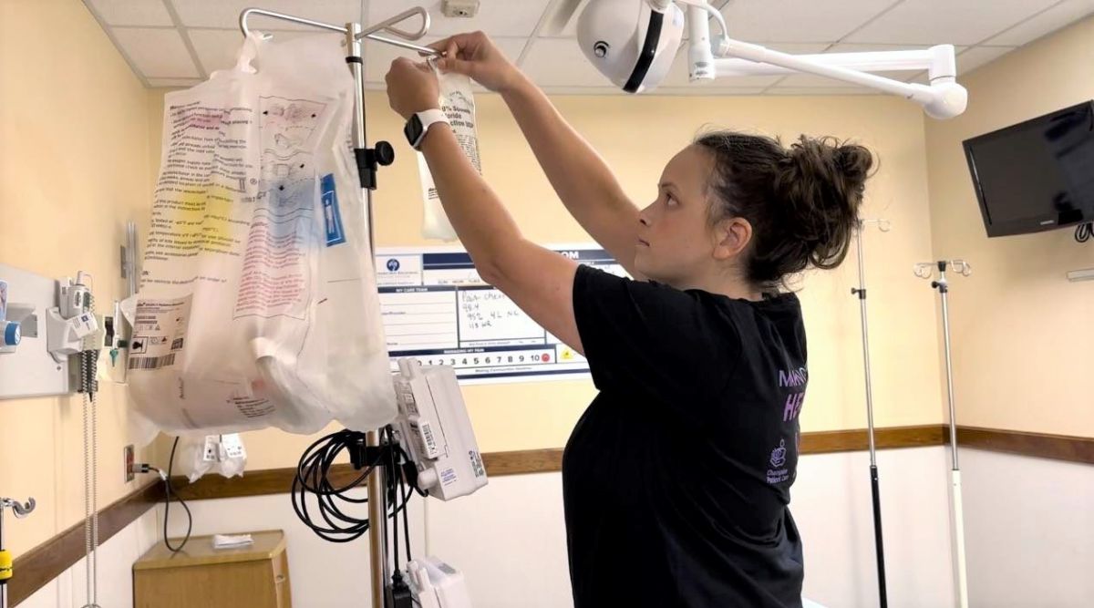 Brittany Owens, RN, prepares an IV for a patient in the ED.